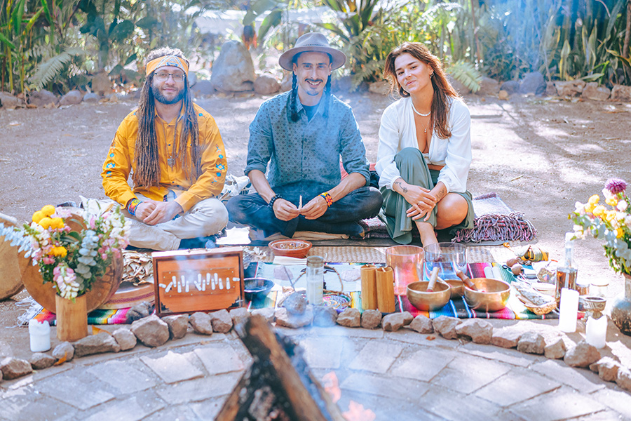 Participants sitting around an outdoor fire pit at Soul Medicine in Nayarit, Mexico.