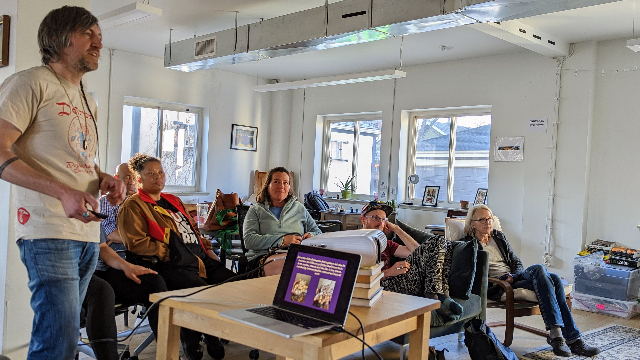 Travis Tyler Fluck, left, gives his Keynote presentation education a class on mushrooms and microdosing during his regular Microdose Mondays class in Denver. Photo by Reilly Capps