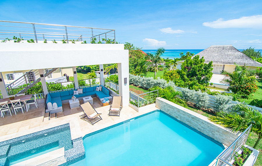 Pool and beach at EQNMT Psilocybin Retreat in Jamaica.