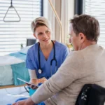 Clinician reviewing a treatment plan with a patient during a consultation