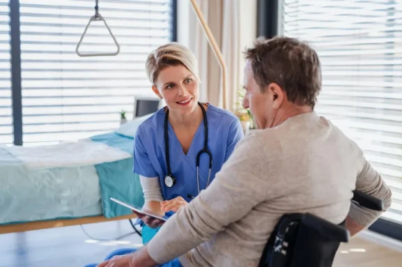 Clinician reviewing a treatment plan with a patient during a consultation