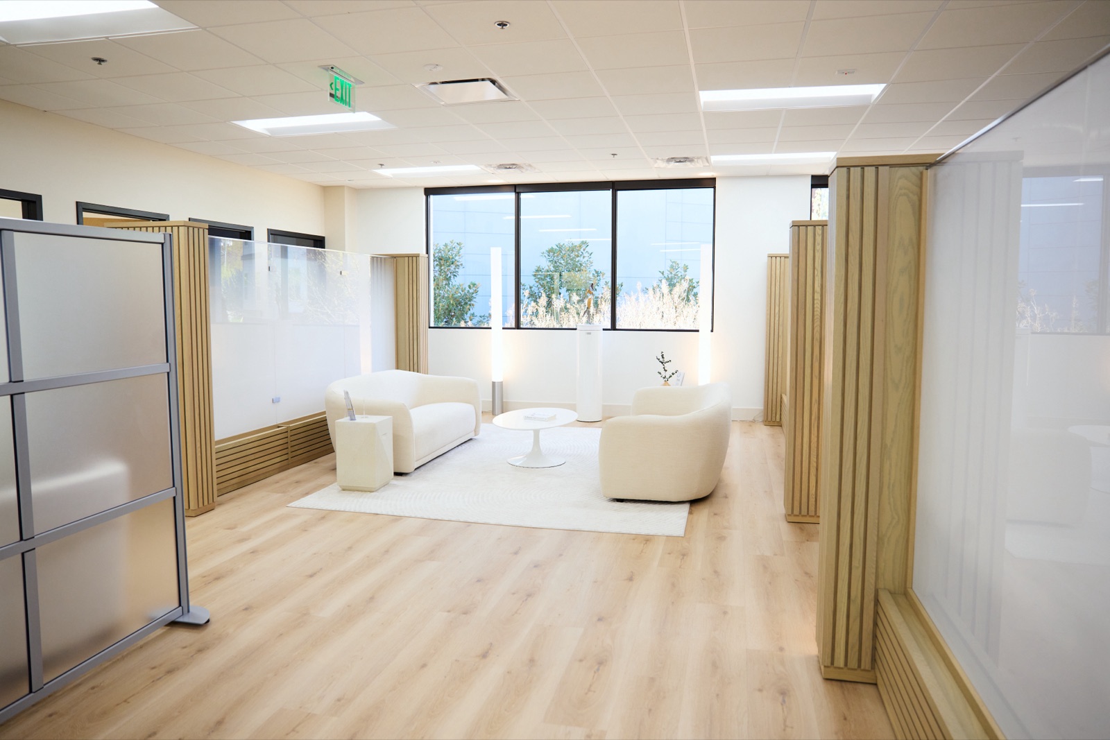 Lounge and treatment-room corridor at Halo Concierge Health